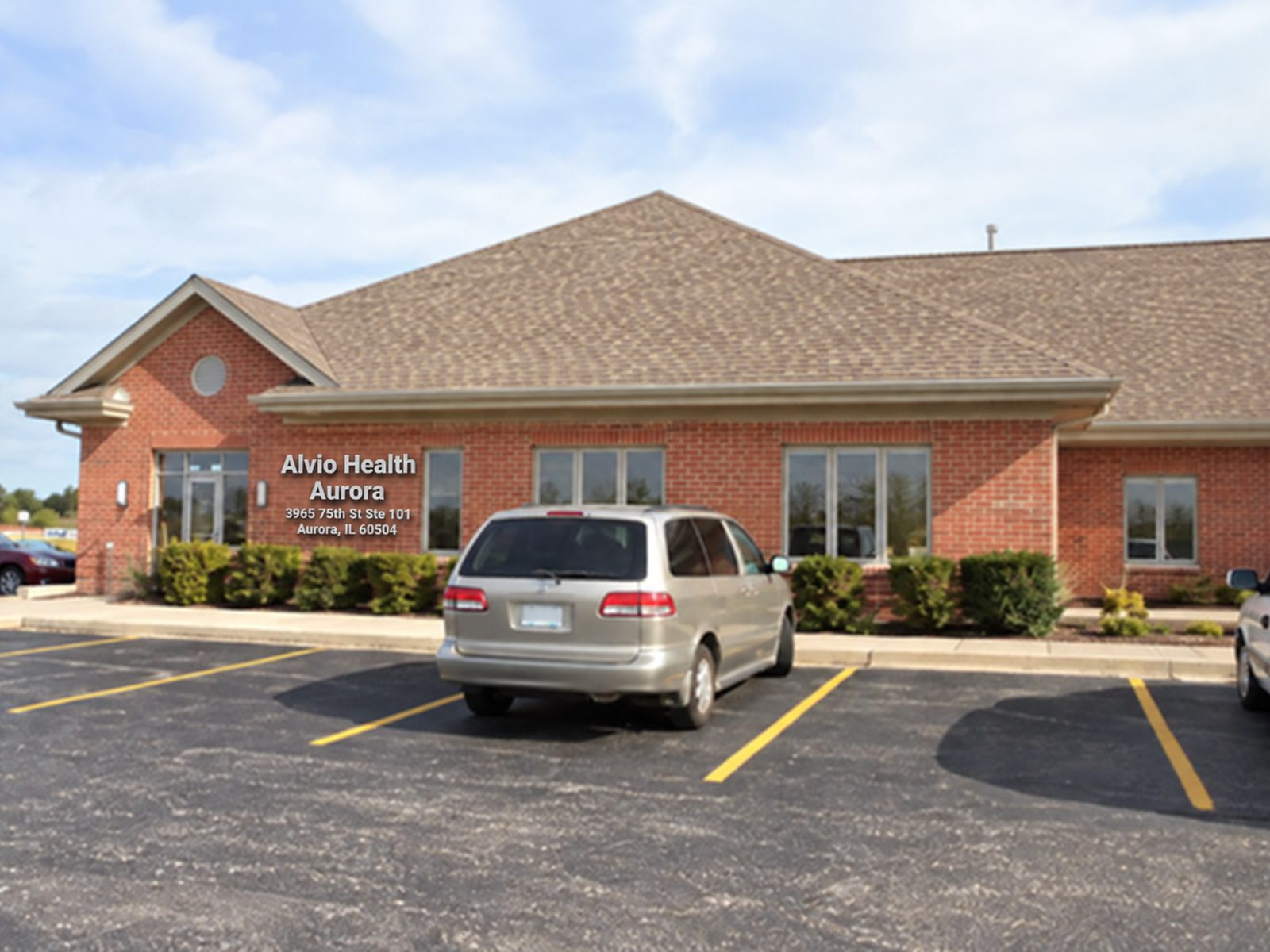 The Alvio Health office on 75th Street in Aurora, seen from its parking lot