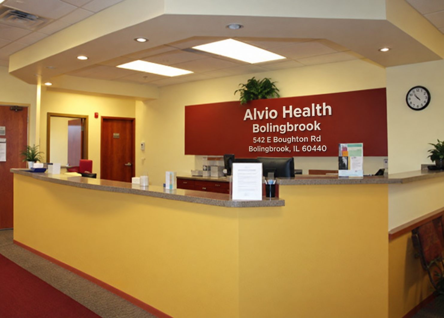 The Alvio Health Bolingbrook reception desk, with the practice name on the wall behind it